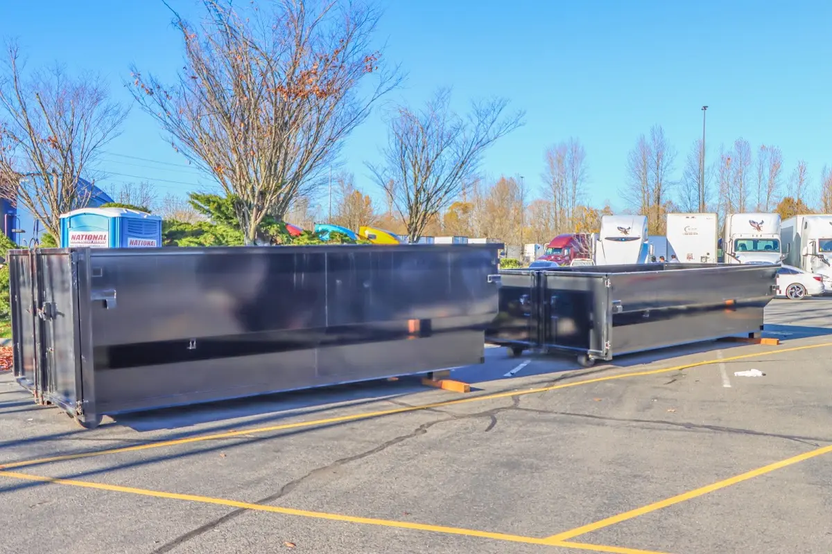 Professional dumpster rental service with roll-off container on residential driveway in Camp Pendleton Mainside